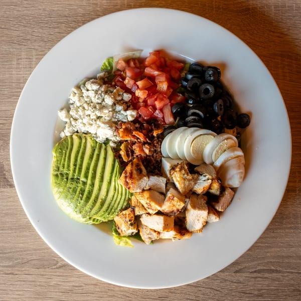 Republic's Cobb salad with grilled chicken, avocado, tomatoes, olives, blue cheese, bacon, and eggs.